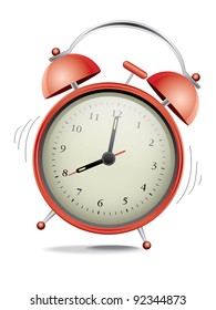 Classic red alarm clock over white background