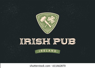 Classic retro styled label for Irish Pub with logo and text irish pub, ireland and hand-drawn hammer of blacksmith and shamrock of clover, Logo for beer pub, bar and restaurants. Vector Illustration