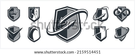 Classic shields shapes set with different additional elements vector symbols set, defense and safety icons, ammo emblems collection.