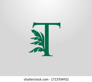 Classic T Letter Luxury Logo. Letter T With Green Floral Shape design perfect for fashion, Jewelry, Beauty Salon, Hotel Logo. Cosmetics, Spa Logo. Resort and Restaurant Logo. 