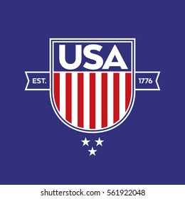 A classic USA shield with stars and stripes over a blue background. This patriotic crest includes the establishment date of the United States of America.
