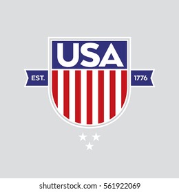 A classic USA shield with stars and stripes over a plain background. This patriotic crest includes the establishment date of the United States of America.