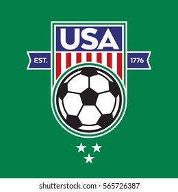A classic USA shield with stars and stripes over a green background. This sports crest includes a soccer ball and the establishment date of the United States of America.