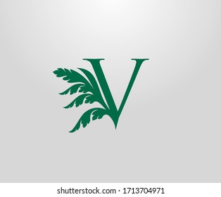 Classic V Letter Luxury Logo. Letter V With Green Floral Shape design perfect for fashion, Jewelry, Beauty Salon, Hotel Logo. Cosmetics, Spa Logo. Resort and Restaurant Logo. 