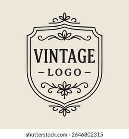 Um logotipo clássico vintage com floreios decorativos e o texto 'Logotipo Vintage' contido em um escudo. Ideal para marcas que buscam uma estética elegante intemporal para várias aplicações.