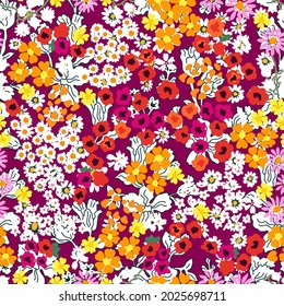 Classical ditsy floral print on red background. Summer textile collection.