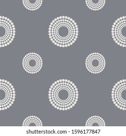 Classical luxury seamless pattern with round white pearls composition on the grey background. Elegant ornament for textile, wrapping paper, packet, poster, card, invitation. Vector illustration