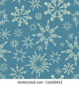 Classical winter seamless pattern with elegance lace snowflakes.