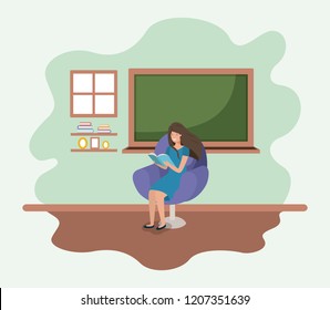 classroom with female teacher reading book in the sofa