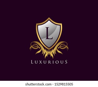 Classy Golden Shield L Letter Logo. Vintage Shield With L Letter prefect for boutique, hotel, restaurant, wedding and other elegant business. 