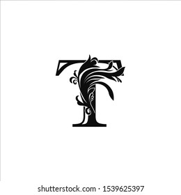 Classy Monogram Luxury Initial Letter T logo design concept on black color with floral shape for luxuries business, fashion, hotel, royal and more brands.
