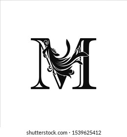 Classy Monogram Luxury Initial Letter M logo design concept on black color with floral shape for luxuries business, fashion, hotel, royal and more brands.