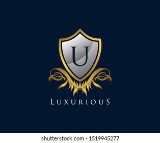 Classy Shield U Letter Logo. Gold Vintage Shield With U Letter prefect for boutique, hotel, restaurant, wedding and other elegant business. 