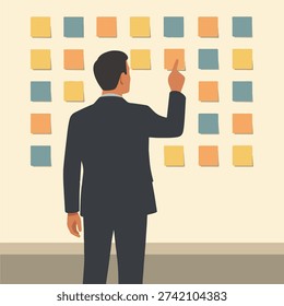 Clean flat illustration showing a man in a dark suit standing with his back to the viewer, facing a wall covered in a neat grid of pastel-colored sticky notes in yellow, peachy orange, and pale blue-grey. His right arm is raised with index finger pointing at a specific note, conveying active engagement in planning, ideation, or task management. Neutral beige wall and subtle ledge at bottom create focused workspace atmosphere with minimalist aesthetic perfect for business, productivity, and organization-themed content.