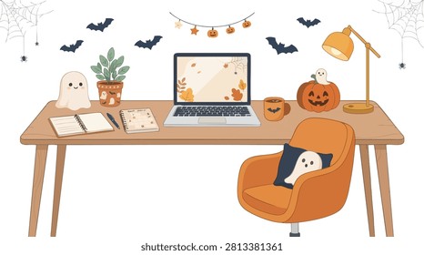 Clean office table with halloween decorations, laptop and spider webs