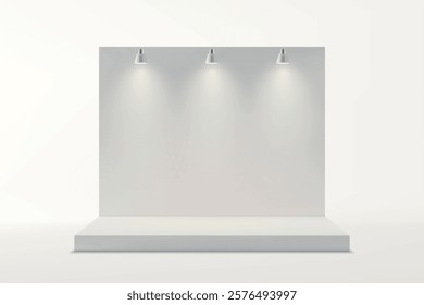 A clean white exhibition backdrop illuminated by three black spotlights on a raised platform