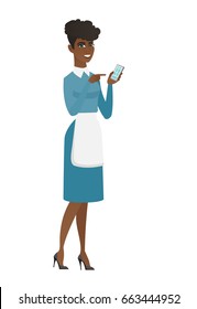 Cleaner in uniform holding mobile phone and pointing at it. Full length of young cleaner with mobile phone. Cleaner using mobile phone. Vector flat design illustration isolated on white background.