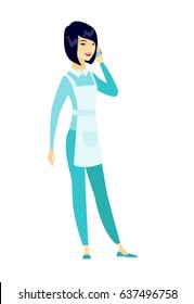 Cleaner in uniform talking on a mobile phone. Cleaner talking on a cell phone. Full length of young cleaner talking on a mobile phone. Vector flat design illustration isolated on white background.