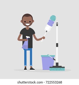 Cleaning The Apartment, Conceptual Illustration. Young Black Character Holding The Cleaning Tools: A Feather Duster And A Spray / Flat Editable Vector Illustration, Clip Art