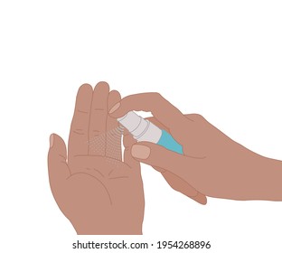 Cleaning a hand with alcohol spray, on white background.