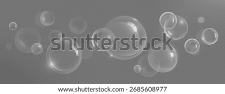 Clear soap spheres with shampoo bubble floating on gray background for clean cosmetic design. Transparent glossy orbs with light highlights and various sizes. Minimalist bath product elements.