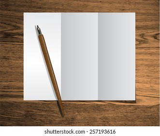clear trifold template on wood texture with ink pen
