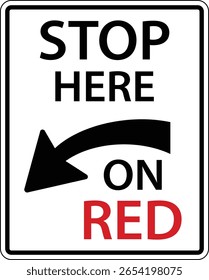 A clear and visible traffic sign indicating to drivers to stop here on red. The sign features a prominent arrow directing traffic for safety compliance and effective communication.