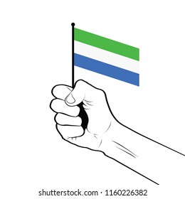 Clenched fist raised in the air holding the national flag of Sierra Leone