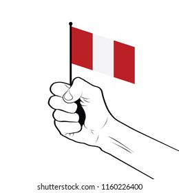 Clenched fist raised in the air holding the national flag of Peru