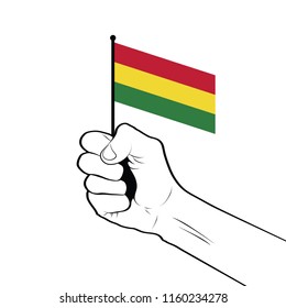 Clenched fist raised in the air holding the national flag of Bolivia