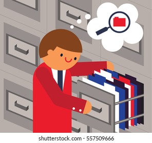 Clerk Opens A Cabinet Looking For A Folder