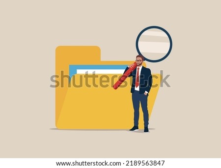 Clerk search files data with magnifying glass in folder. Tidying up and organizing file and document in database.