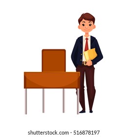 Clever school boy standing at the desk and holding a book, cartoon vector illustration isolated on white background. 