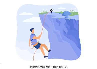 Climber hanging on rope and pulling himself on top of rocky mountain wall. Extreme mountaineer climbing on cliff. For sport, outdoor activity, risk, alpinist concept