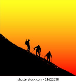 Climbers ascending a ridge at sunset in the alps