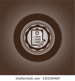clinic history icon inside badge with wooden background