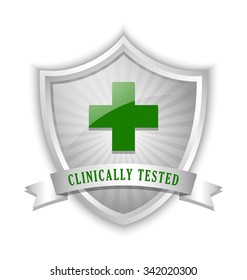 Clinically tested symbol shield with cross and ribbon on white background