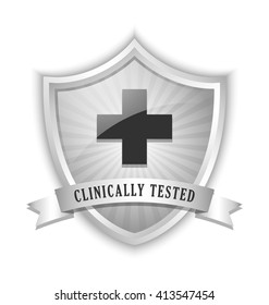 Clinically tested symbol shield with cross and ribbon on white background