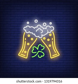 Clinking beer glasses with clover neon sign. Saint Patricks Day design. Night bright neon sign, colorful billboard, light banner. Vector illustration in neon style.