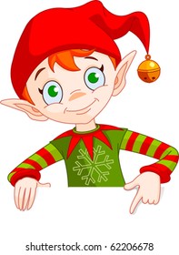 Clipart Illustration Of A Christmas Elf Holding And Pointing Down To A Blank White Sign