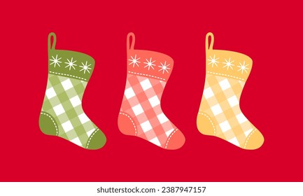 Clipart set with Christmas plaid stockings on isolated red background. Holiday design for Christmas home decor, holiday greetings, Christmas and New Year celebration. 