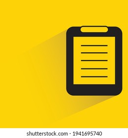 clipboard with shadow on yellow background