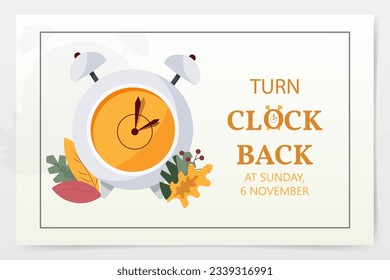 
the clock changes to winter time, autumn leaves against the background of an alarm clock,