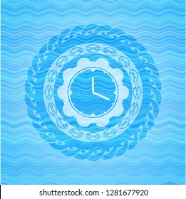 clock, time icon inside sky blue water wave badge.