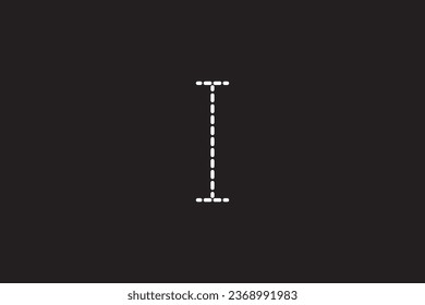a close up of a black background with a white letter I