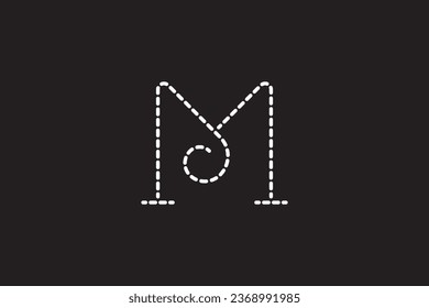 a close up of a black background with a white letter M