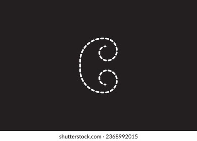 a close up of a black background with a white letter C
