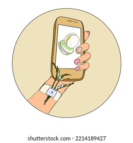 Close up of female hands holding phone with sweet dessert on mobile phone. A woman takes photos of delicious baked goods, arranges the delivery with the help of a mobile phone camera.