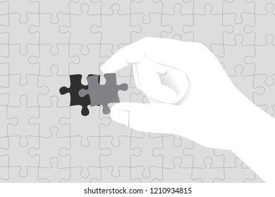 close up hand lay last jigsaw piece to complete puzzle. business concept of solution and mission.