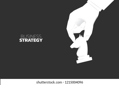 close up hand move knight chess piece. concept of business strategy and marketing plan